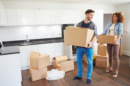 Movers unpacking household items in a Wandsworth property