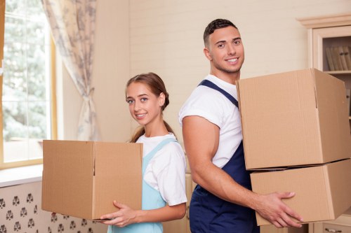 Local Wandsworth moving team transporting furniture carefully