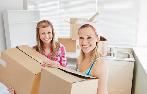 Team safely moving fragile household items during removals in Wandsworth